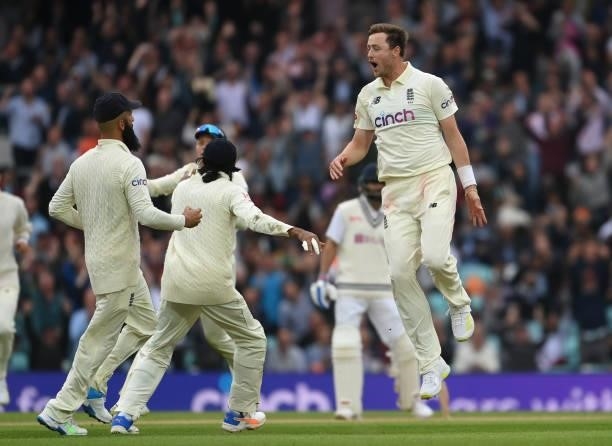 Ollie Robinson of England celebrates with team mates after dismissing Cheteshwar Pujara of India during the Fourth LV= Insurance Test Match: Day...