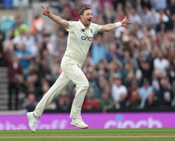 Ollie Robinson of England celebrates taking the wicket of Cheteshwar Pujara of India during day three of the fourth LV= Insurance Test match between...