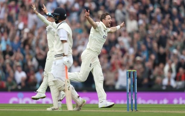 Ollie Robinson of England celebrates taking the wicket of Cheteshwar Pujara of India during day three of the fourth LV= Insurance Test match between...