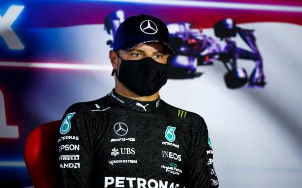 Third place qualifier Valtteri Bottas of Finland and Mercedes GP talks in the press conference after qualifying ahead of the F1 Grand Prix of The...