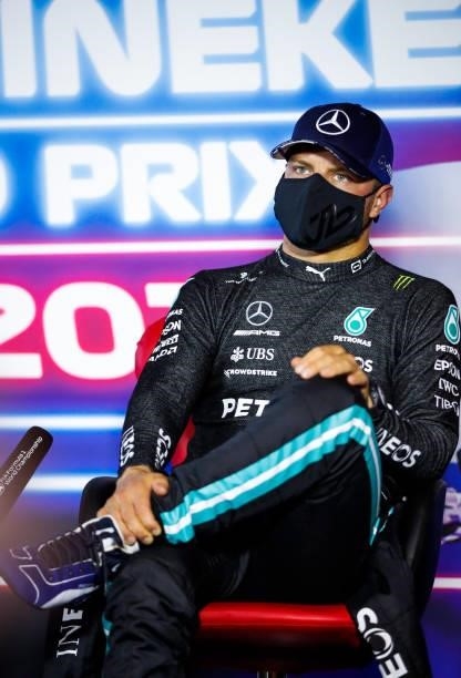 Third place qualifier Valtteri Bottas of Finland and Mercedes GP talks in the press conference after qualifying ahead of the F1 Grand Prix of The...