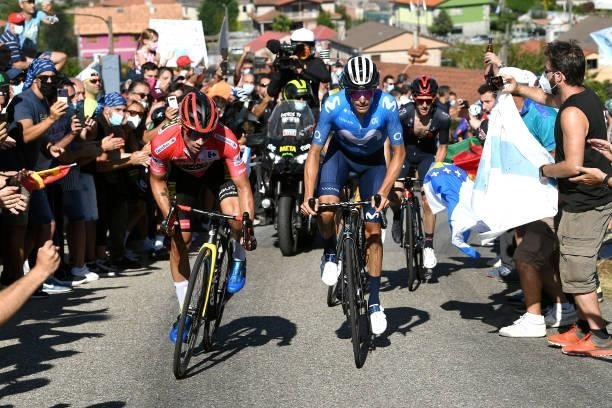 Primoz Roglic of Slovenia and Team Jumbo - Visma red leader jersey and Enric Mas Nicolau of Spain and Movistar Team attack in the breakaway during...