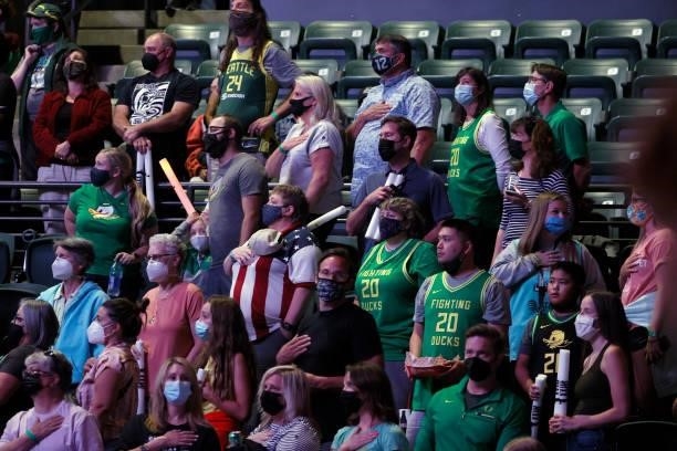 Fans stand for the national anthem before the game between the Seattle Storm and the New York Liberty at Angel of the Winds Arena on September 02,...