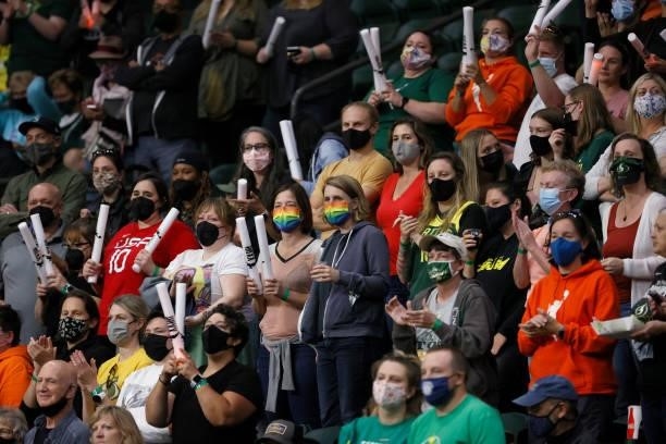 Fans stand as they wait for the first Seattle Storm basket against the New York Liberty at Angel of the Winds Arena on September 02, 2021 in Everett,...