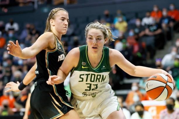Sabrina Ionescu of the New York Liberty defends Katie Lou Samuelson of the Seattle Storm during the first quarter at Angel of the Winds Arena on...
