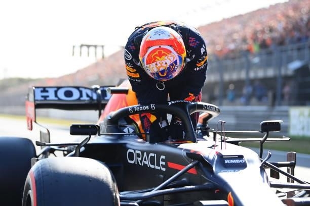Pole position qualifier Max Verstappen of Netherlands and Red Bull Racing climbs from his car in parc ferme during qualifying ahead of the F1 Grand...