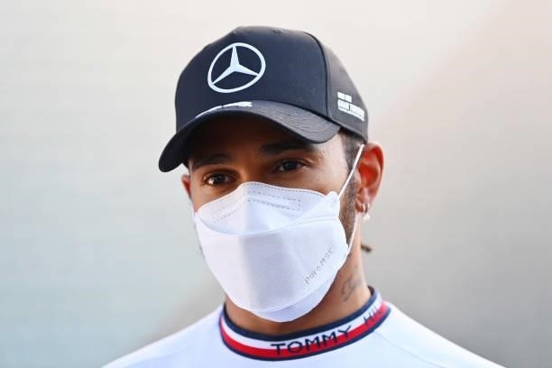 Second place qualifier Lewis Hamilton of Great Britain and Mercedes GP talks to the media in the Paddock after qualifying ahead of the F1 Grand Prix...