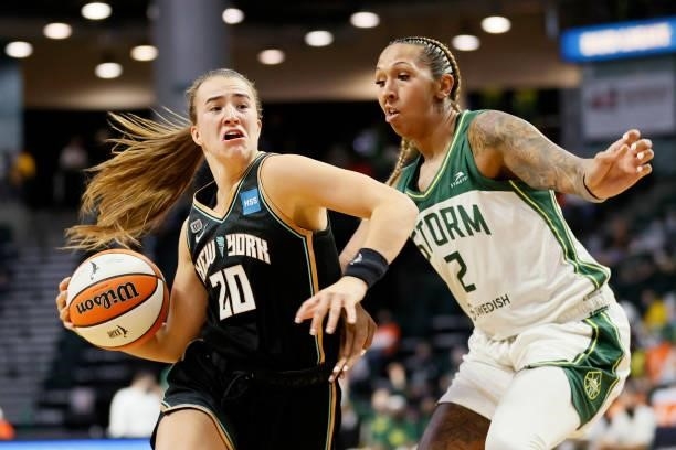 Sabrina Ionescu of the New York Liberty drives to the hoop against Mercedes Russell of the Seattle Storm at Angel of the Winds Arena on September 02,...