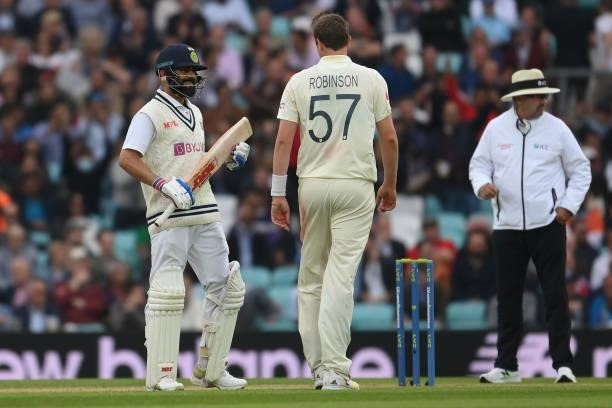 Virat Kohli of India and Ollie Robinson of England exchange pleasantries during the Fourth LV= Insurance Test Match: Day Three between England and...