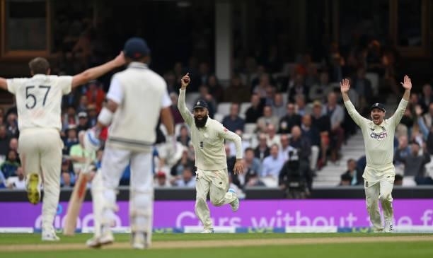 Moeen Ali of England celebrates catching out Cheteshwar Pujara of India during day three of the Fourth LV= Insurance Test Match between England and...