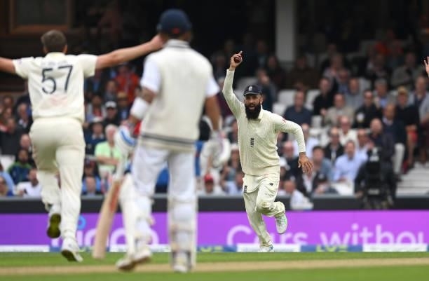 Moeen Ali of England celebrates catching out Cheteshwar Pujara of India during day three of the Fourth LV= Insurance Test Match between England and...