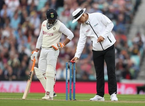 The umpire takes a light reading as play is suspended for bad light during day three of the fourth LV= Insurance Test match between England and India...