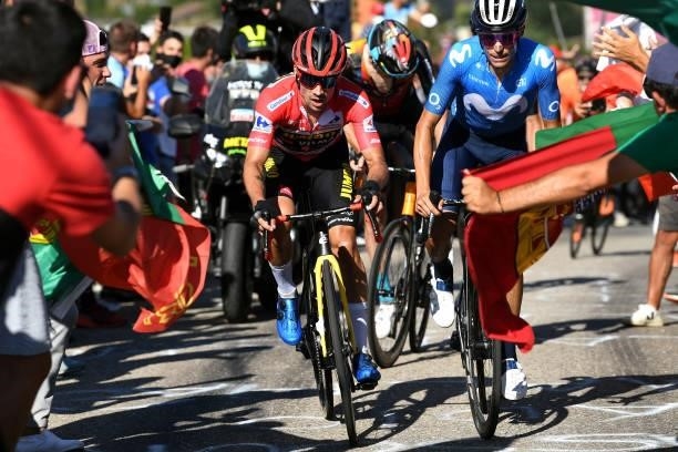 Primoz Roglic of Slovenia and Team Jumbo - Visma red leader jersey and Enric Mas Nicolau of Spain and Movistar Team attack in the breakaway while...