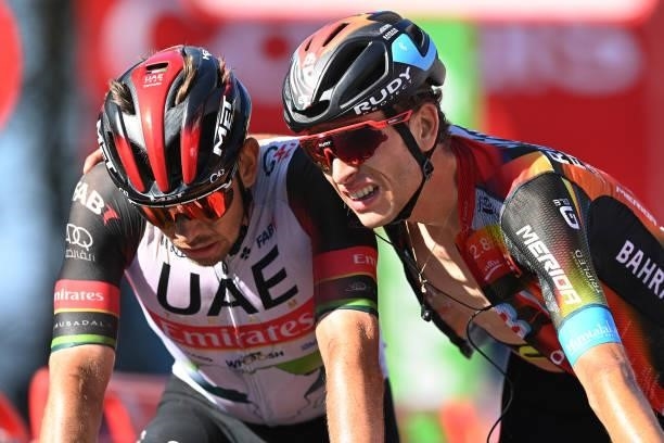 Ryan Gibbons of South Africa and UAE Team Emirates and Gino Mäder of Switzerland and Team Bahrain Victorious cross the finishing line during the 76th...