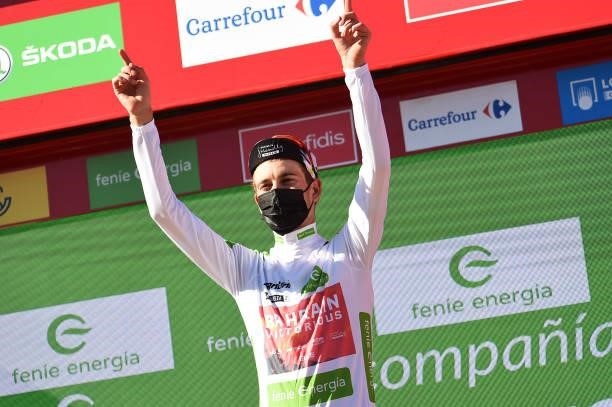 Gino Mäder of Switzerland and Team Bahrain Victorious celebrates winning the white best young jersey on the podium ceremony after the 76th Tour of...