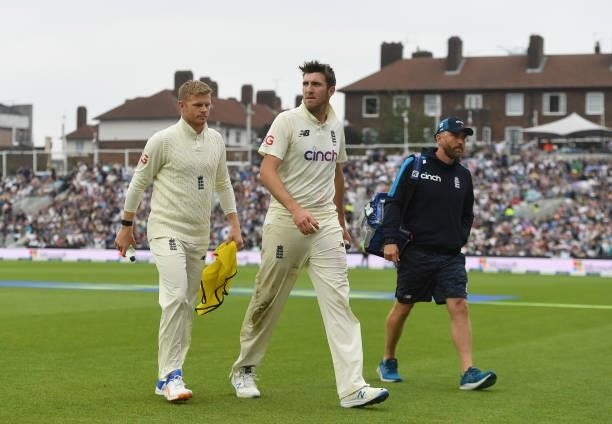 Craig Overton of England walks off the field with Sam Billings and Craig de Weymarn during the third day of the 4th LV= Test Match between England...