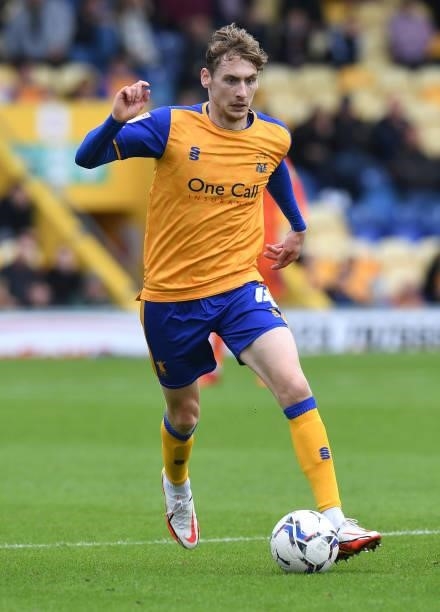 Elliott Hewitt of Mansfield Town runs with the ball during the Sky Bet League Two match between Mansfield Town and Harrogate Town at One Call Stadium...