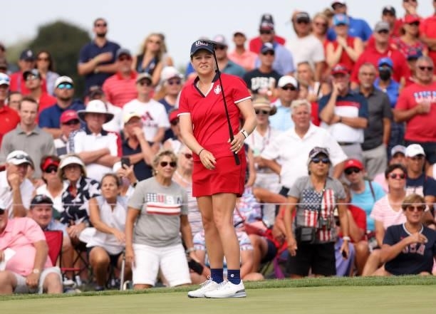 Ally Ewing of Team USA reacts to her shot on the 12th green during the Foursomes Match on day one of the Solheim Cup at the Inverness Club on...