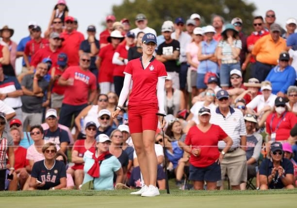 Nelly Korda of Team USA reacts to her putt on the 12th green during the Foursomes Match on day one of the Solheim Cup at the Inverness Club on...