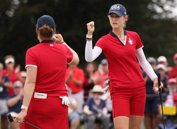 Ally Ewing of Team USA and Nelly Korda of Team USA react on the 16th green during the Foursomes Match on day one of the Solheim Cup at the Inverness...