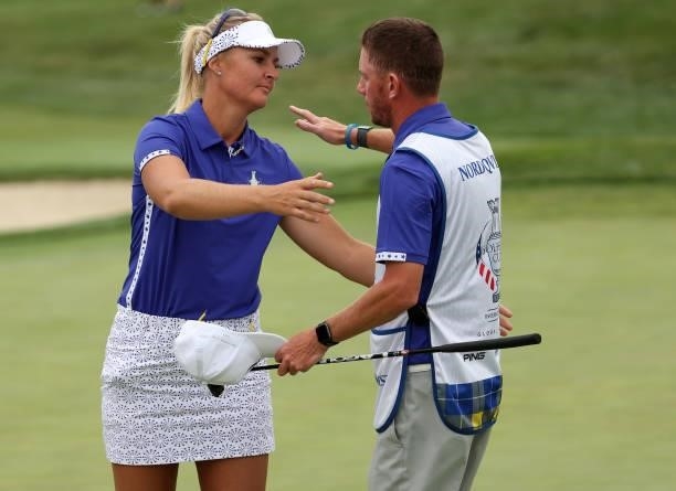 Anna Nordqvist of Team Europe hugs her caddie after winning on the 15th green during the Foursomes Match on day one of the Solheim Cup at the...