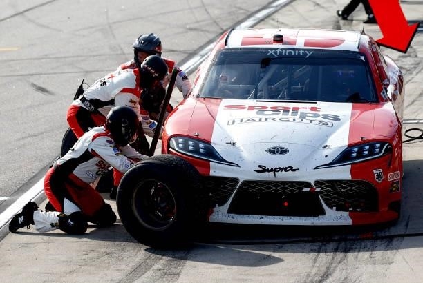 Denny Hamlin, driver of the SportClips Haircuts Toyota, pits during the NASCAR Xfinity Series Sport Clips Haircuts VFW Help A Hero 200 at Darlington...