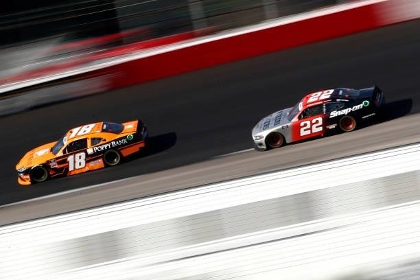 Daniel Hemric, driver of the Poppy Bank Toyota, and Austin Cindric, driver of the Snap on Ford, race during the NASCAR Xfinity Series Sport Clips...