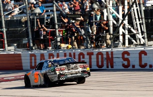 Noah Gragson, driver of the Bass Pro crosses the finish line to win the NASCAR Xfinity Series Sport Clips Haircuts VFW Help A Hero 200 at Darlington...