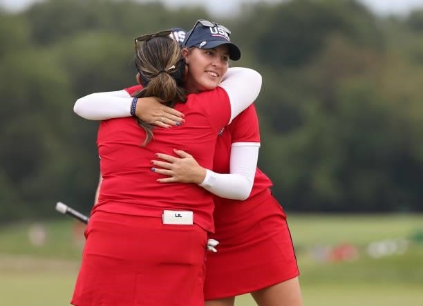 Jennifer Kupcho of Team USA hugs Lizette Salas of Team USA on the 18th green after winning their match during the Foursomes Match on day one of the...