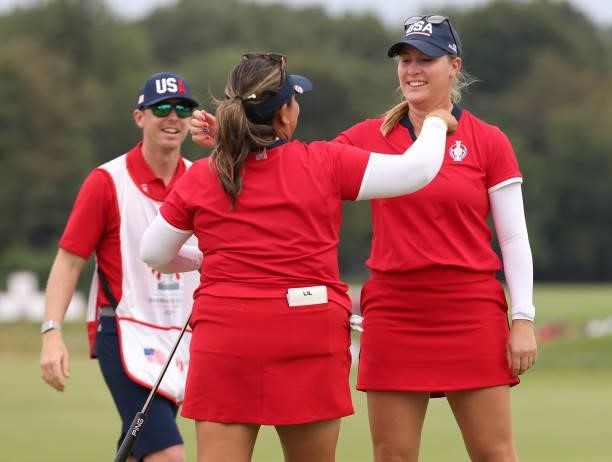 Jennifer Kupcho of Team USA hugs Lizette Salas of Team USA on the 18th green after winning their match during the Foursomes Match on day one of the...