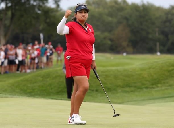 Lizette Salas of Team USA reacts after her putt on the 18th green during the Foursomes Match on day one of the Solheim Cup at the Inverness Club on...
