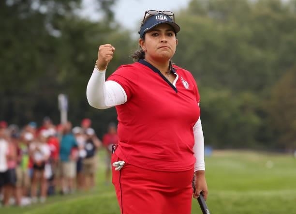 Lizette Salas of Team USA reacts after her putt on the 18th green during the Foursomes Match on day one of the Solheim Cup at the Inverness Club on...