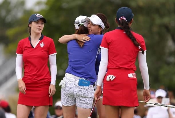 Georgia Hall of Team Europe and Leona Maguire of Team Europe hug after winning their match over Yealimi Noh of Team USA and Brittany Altomare of Team...