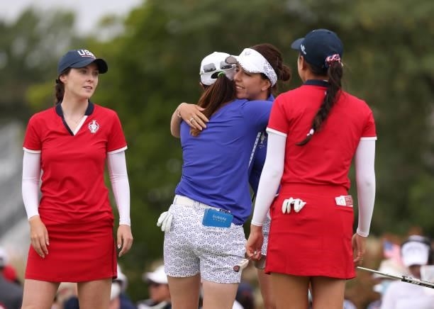 Georgia Hall of Team Europe and Leona Maguire of Team Europe hug after winning their match over Yealimi Noh of Team USA and Brittany Altomare of Team...