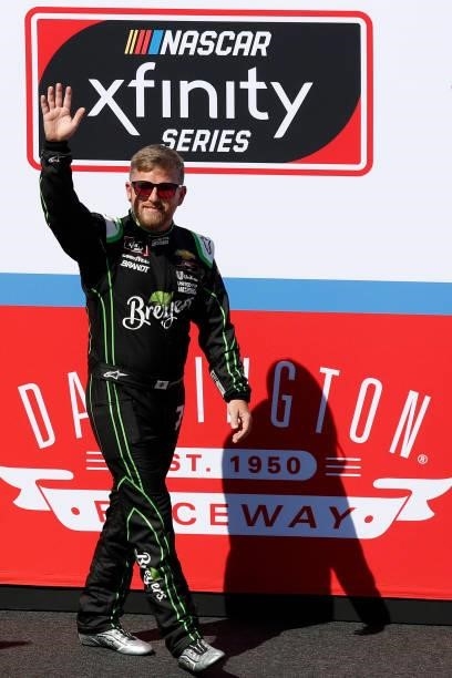 Justin Allgaier, driver of the Breyers Food Lion Feeds Chevrolet, waves to fans during pre-race ceremonies prior to the NASCAR Xfinity Series Sport...