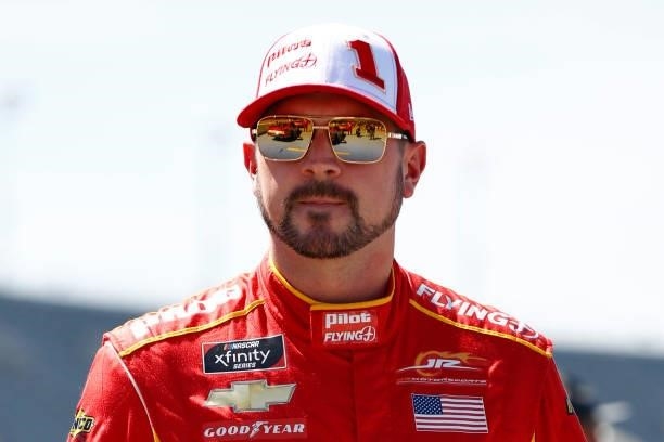 Michael Annett, driver of the PFJ Thank A Trucker Chevrolet, waits on the grid prior to the NASCAR Xfinity Series Sport Clips Haircuts VFW Help A...