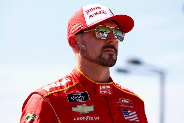 Michael Annett, driver of the PFJ Thank A Trucker Chevrolet, waits on the grid prior to the NASCAR Xfinity Series Sport Clips Haircuts VFW Help A...
