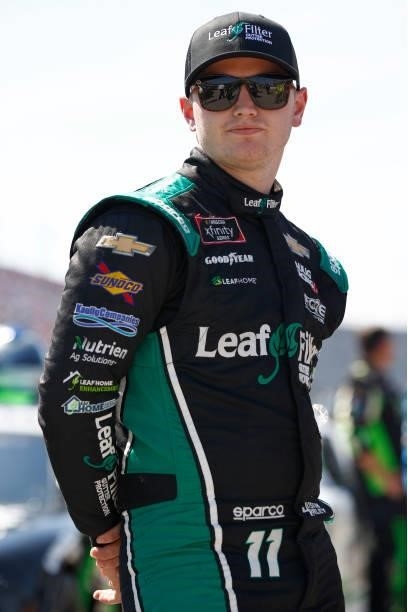 Justin Haley, driver of the LeafFilter Gutter Protection Chevrolet, waits on the grid prior to the NASCAR Xfinity Series Sport Clips Haircuts VFW...