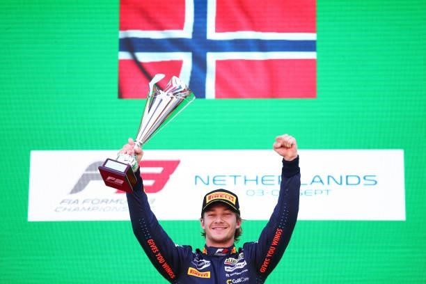 Race winner Dennis Hauger of Norway and Prema Racing celebrates on the podium during race 3 of Round 6:Zandvoort of the Formula 3 Championship at...
