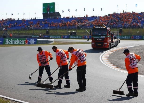 Track marshals sweep dirt from the track after race 3 of Round 6:Zandvoort of the Formula 3 Championship at Circuit Zandvoort on September 05, 2021...