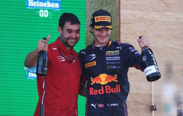 Race winner Dennis Hauger of Norway and Prema Racing and Prema Racing mechanic, Juan Vicente Perez Ballester celebrate on the podium during race 3 of...