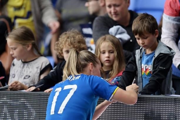 Lucy Graham of Everton Women signs autographs for the fans after the Barclays FA Women's Super League match between Everton Women and Manchester City...