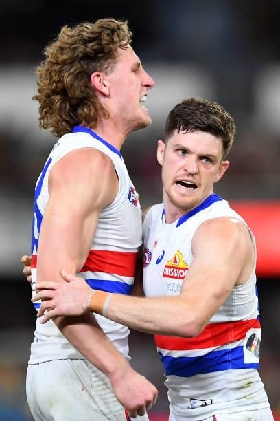 Aaron Naughton and Taylor Duryea of the Bulldogs celebrate victory during the AFL 1st Semi Final match between the Brisbane Lions and the Western...