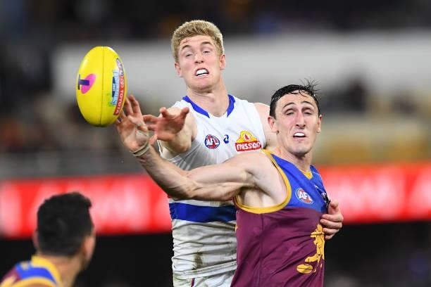 Tim English of the Bulldogs and Oscar McInerney of the Lions compete for the ball during the AFL 1st Semi Final match between the Brisbane Lions and...