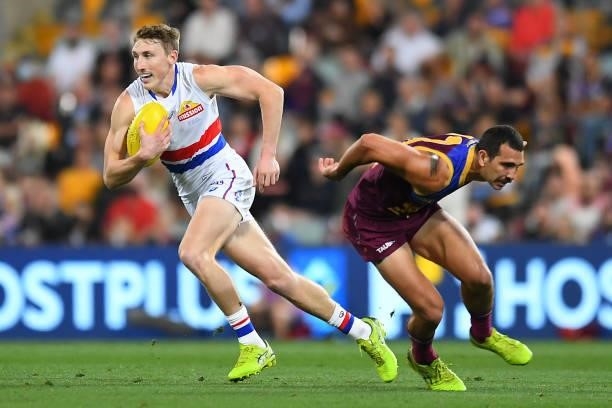 Bailey Dale of the Bulldogs gets past Nakia Cockatoo of the Lions during the AFL 1st Semi Final match between the Brisbane Lions and the Western...
