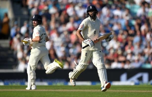 Haseeb Hameed and Rory Burns of England run between the wickets during day four of the Fourth LV= Insurance Test Match between England and India at...