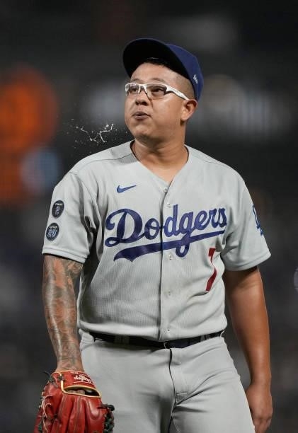 Julio Urias of the Los Angeles Dodgers looks on walking back to the dugout after he was taken out of the game against the San Francisco Giants in the...