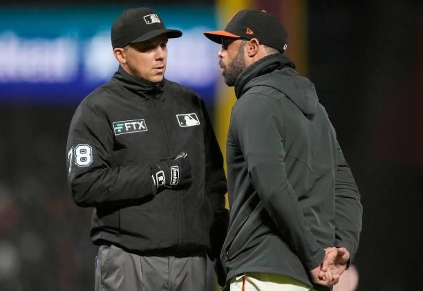 Manager Gabe Kapler of the San Francisco Giants argues with umpire Adam Hamari after Hamari called a balk on pitcher Jose Quintana against the Los...