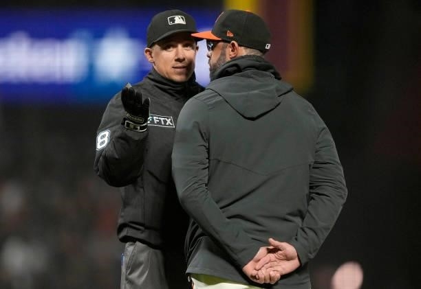 Manager Gabe Kapler of the San Francisco Giants argues with umpire Adam Hamari after Hamari called a balk on pitcher Jose Quintana against the Los...