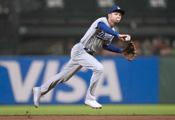 Trea Turner of the Los Angeles Dodgers tosses the ball on to first base to get Austin Slater of the San Francisco Giants in the bottom of the fifth...